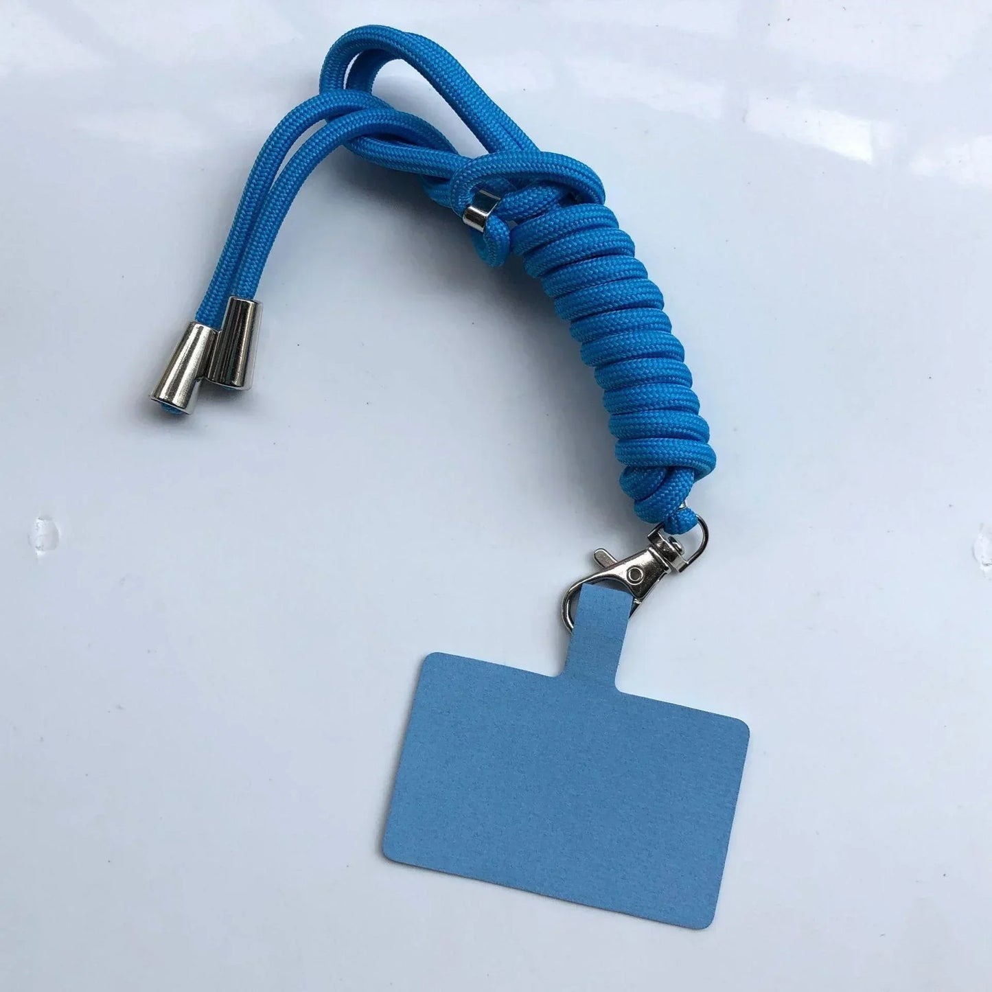 Blue lanyard with a badge holder on a white background