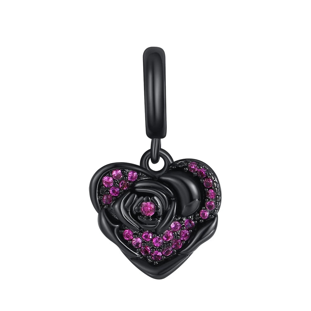 Black heart-shaped pendant with pink gemstones on a white background. pandora style charm pendant. Gothic style, halloween theme