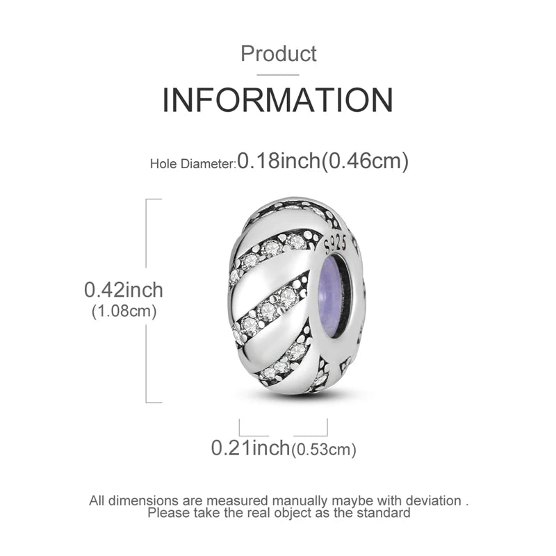 Silver charm with measurements on a white background