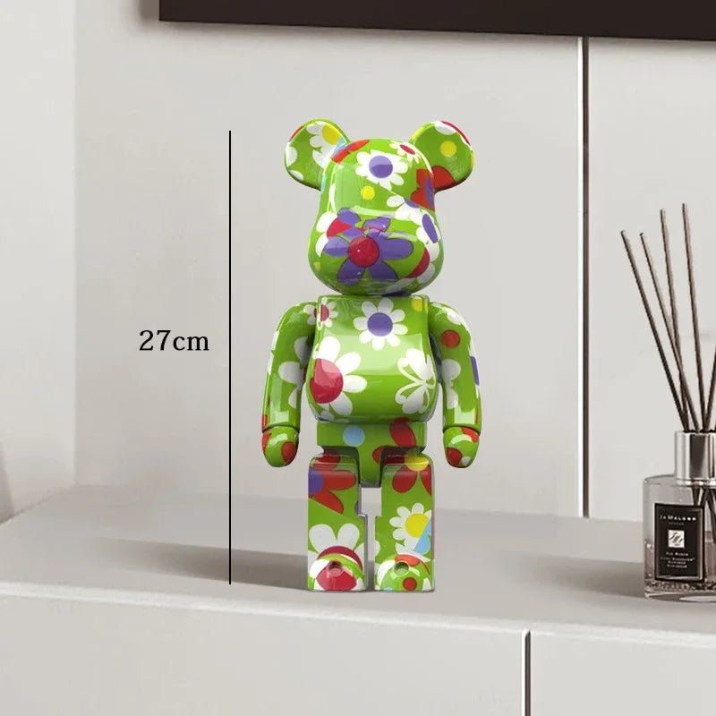 Colorful floral-patterned bear figure on a white surface with a diffuser in the background be@rbrick collectable