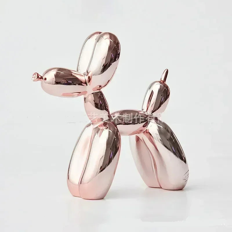 Rose gold balloon dog sculpture on a white background