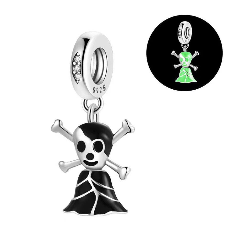 Pandora-style charm with skull and crossbones design on a white background. pandora style charm pendant. Gothic style, halloween theme. Glow in the dark