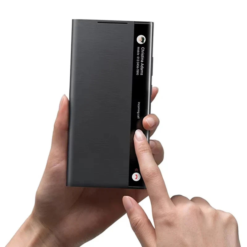 Black phone case held by a hand with a white background