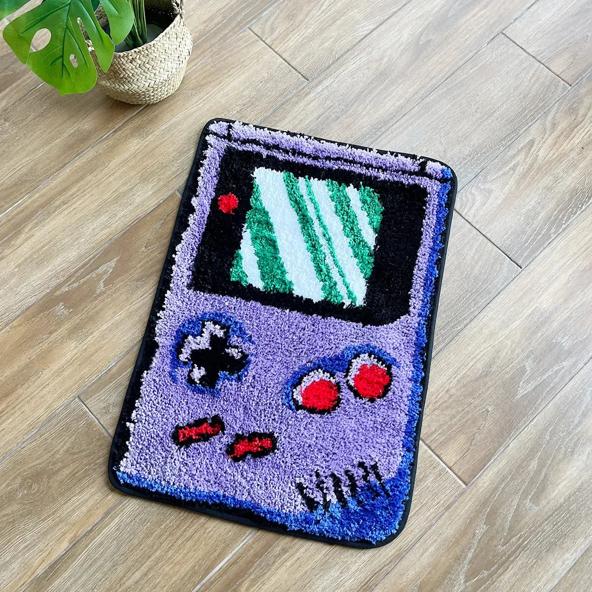 Decorative rug shaped like a vintage video game console on a wooden floor.