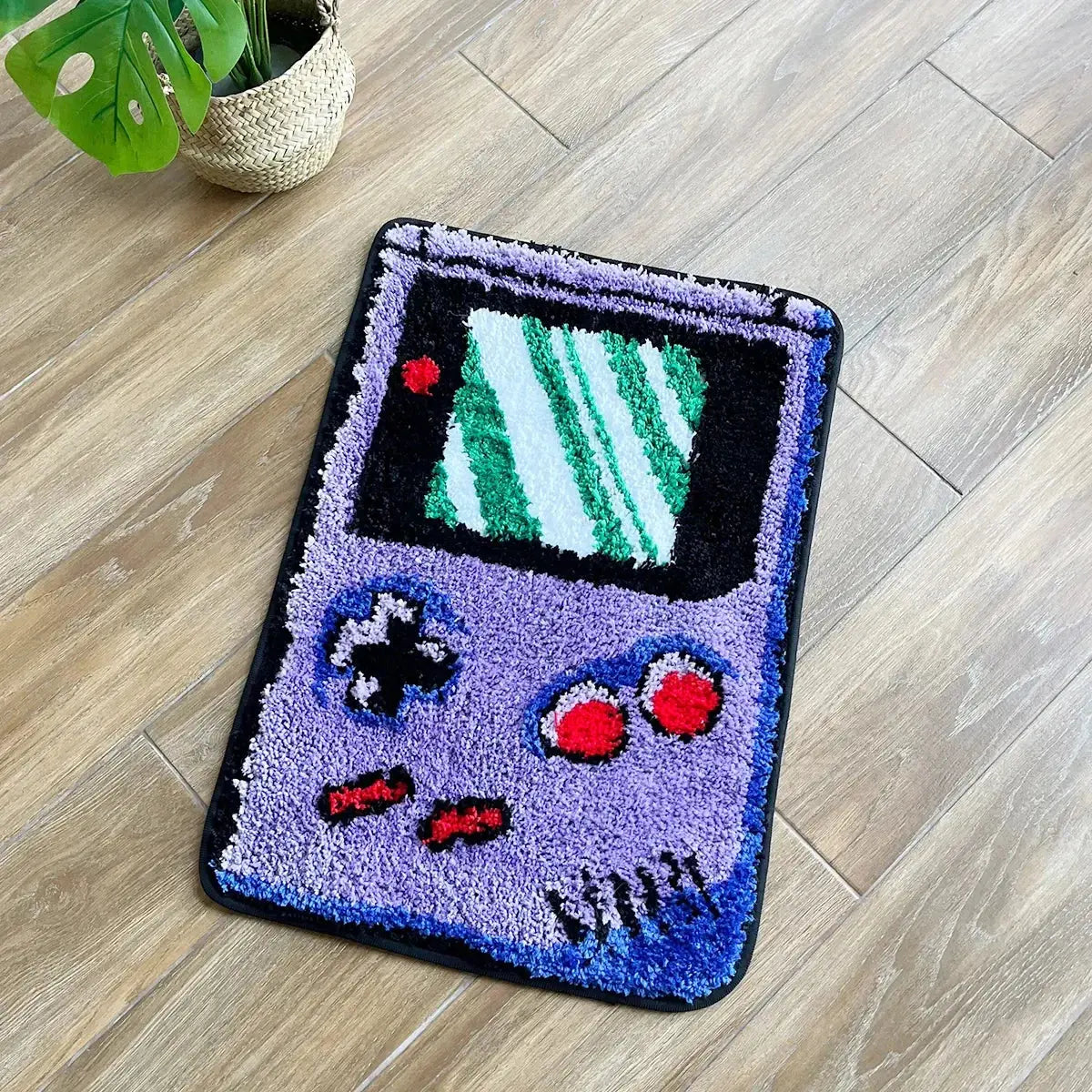 Decorative rug shaped like a vintage video game console on a wooden floor.