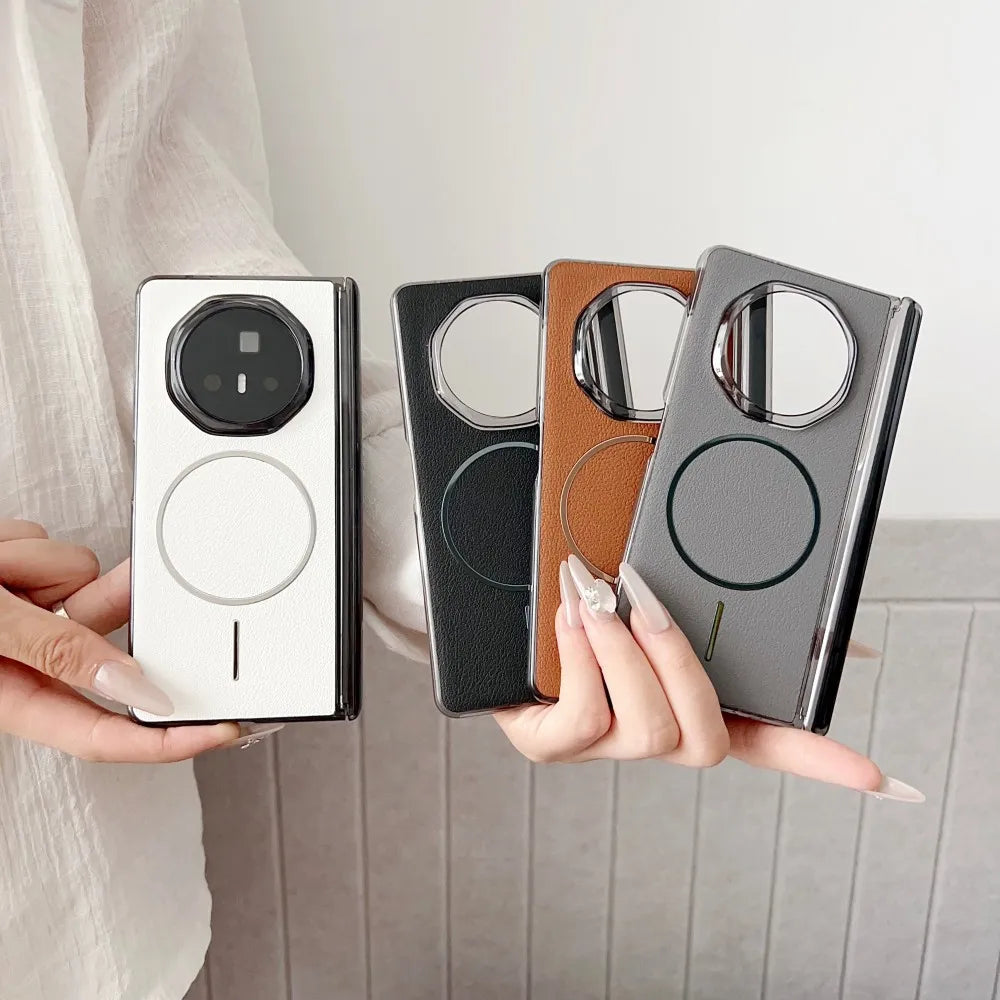 Four phone cases in different colors held by a person against a neutral background