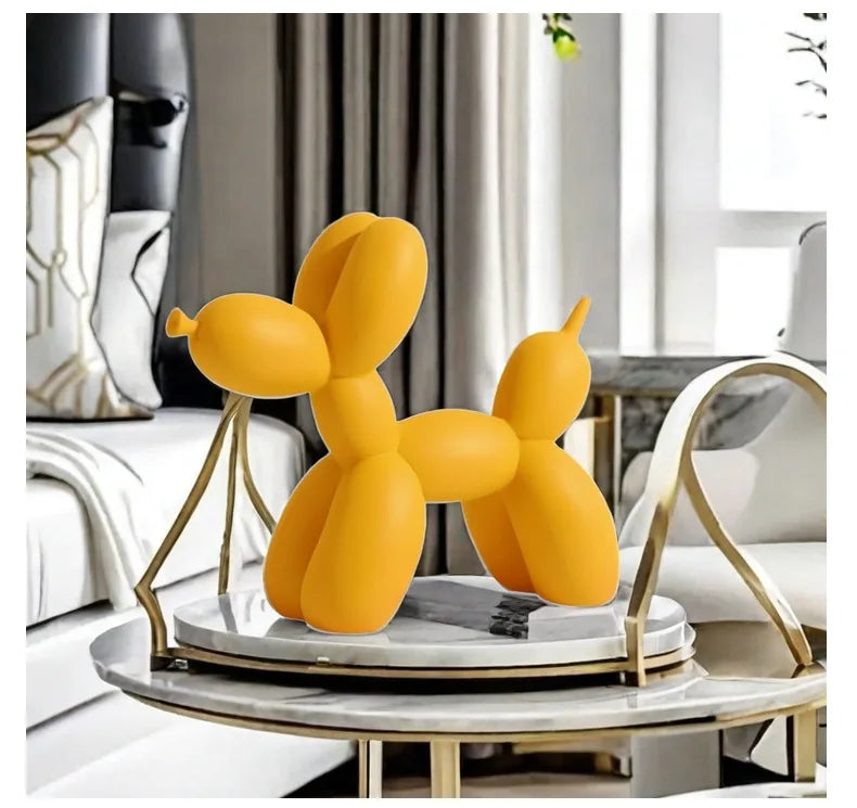 Yellow balloon dog sculpture on a table in a living room setting