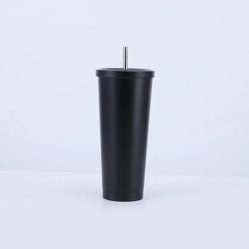 Black tumbler with a metal straw on a white background