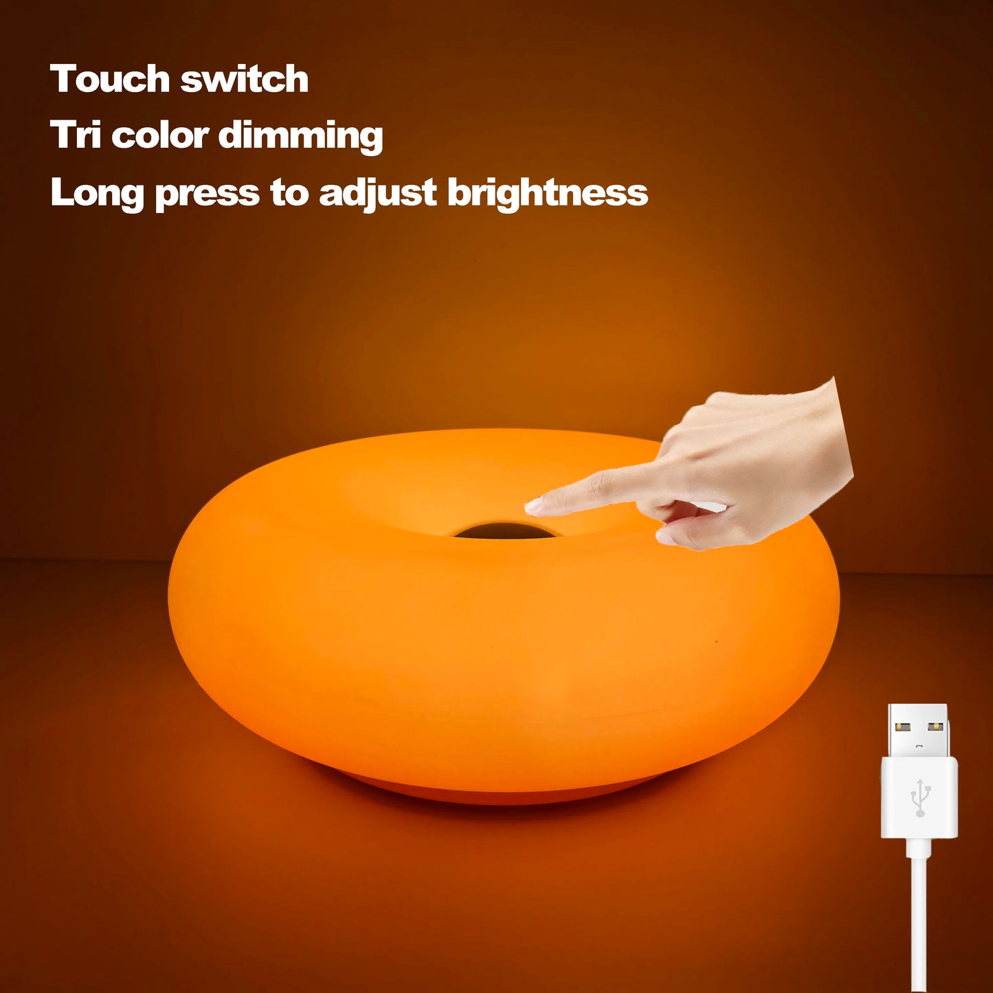Orange LED lamp with a hand pressing a touch switch on a brown background