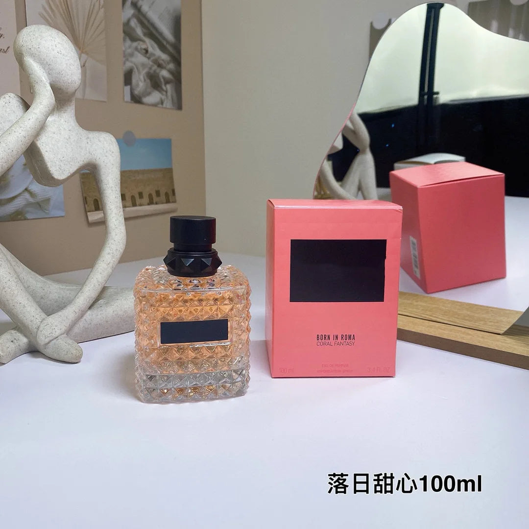 Valentino Perfume bottle and packaging on a table with decorative items in the background