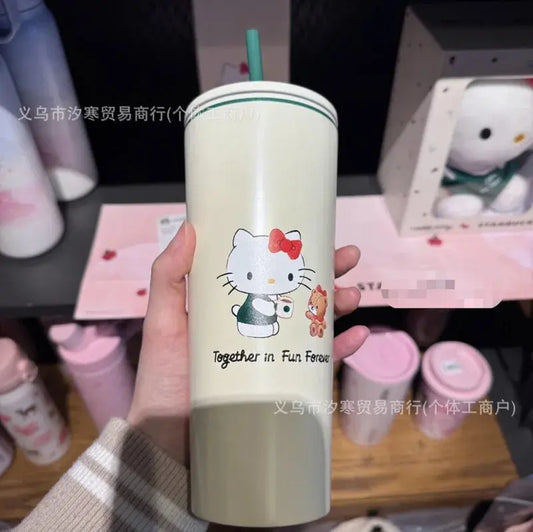 Hello Kitty Beige tumbler with cartoon character design held by a hand, with blurred background