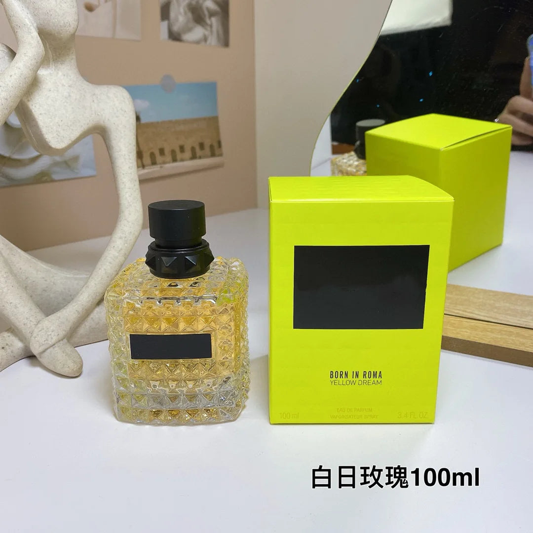 Valentino Perfume bottle with yellow packaging on a white surface