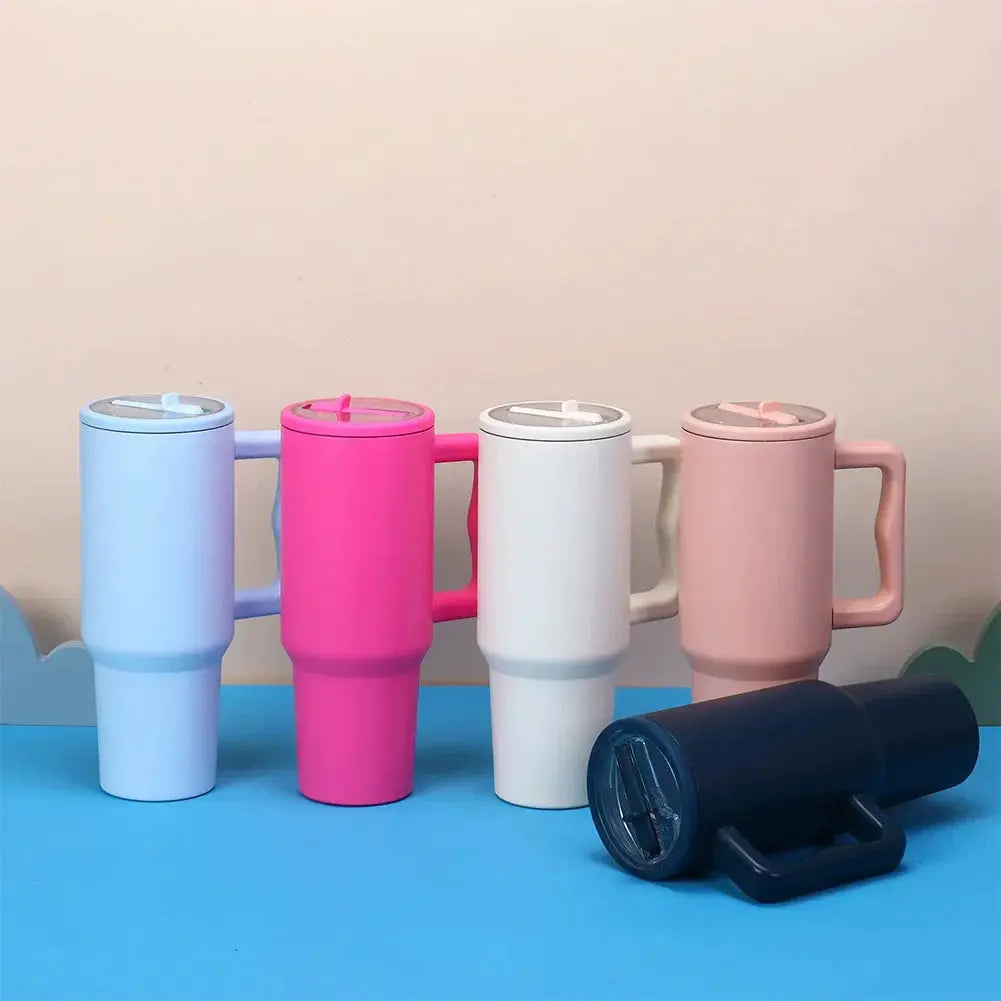 Colorful 40 oz tumblers with flip straw lids shown upright and sideways, compatible with Stanley Quencher, reusable and spill proof