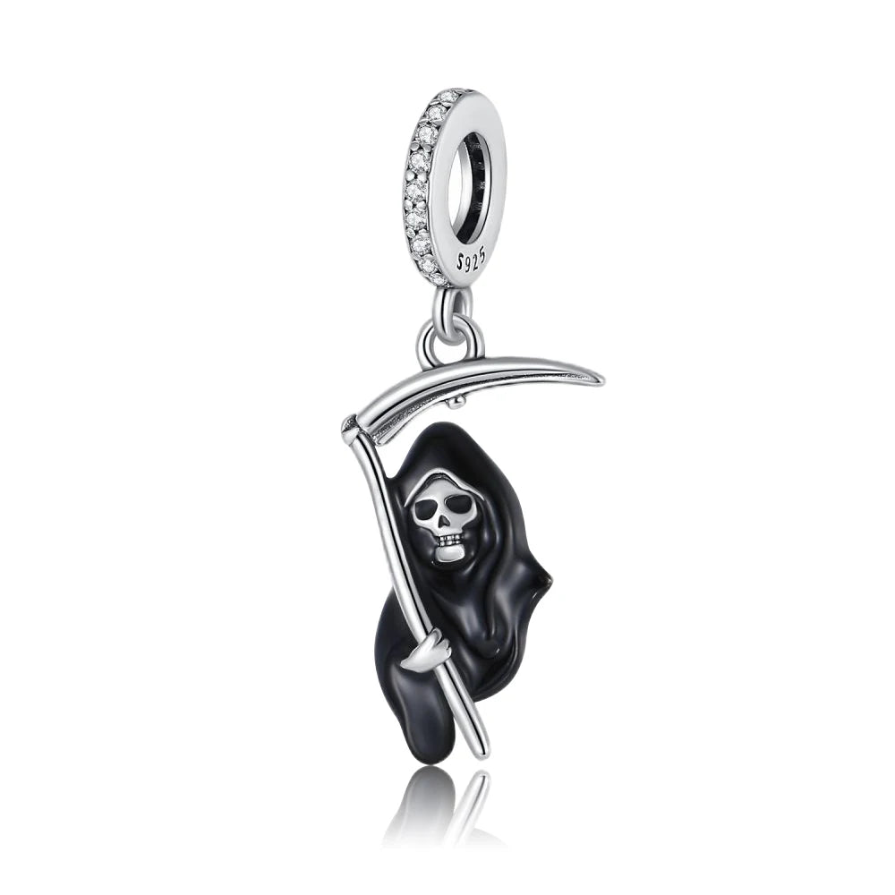 Silver pendant with a black hooded grim reaper skull design on a white background. pandora style charm pendant. Gothic style, halloween theme
