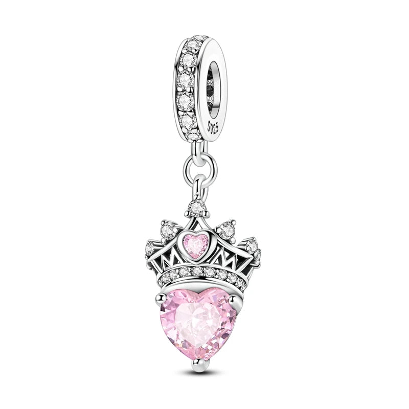 Jewelry charm with pink heart and crown design on a white background