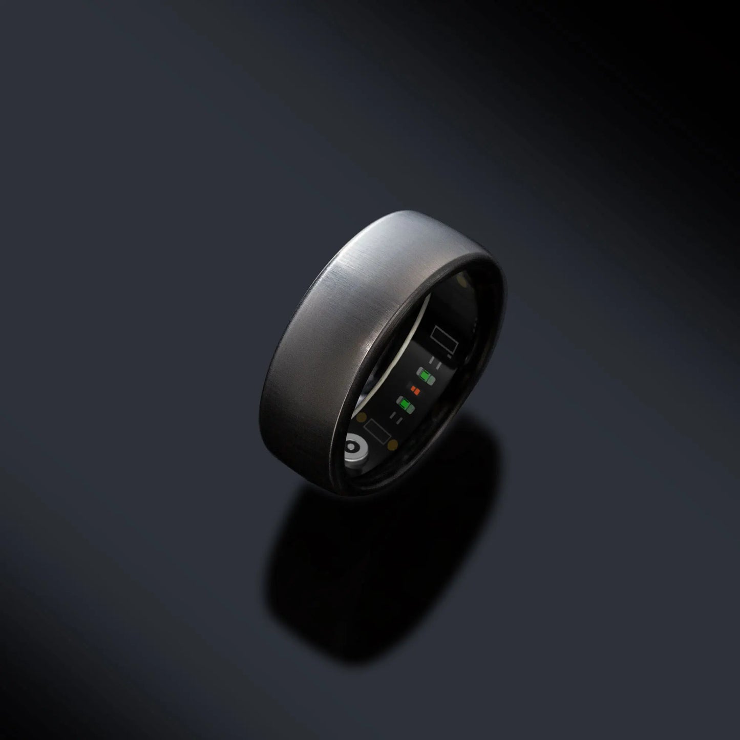 oura smart ring Smart ring with electronic components on a dark background