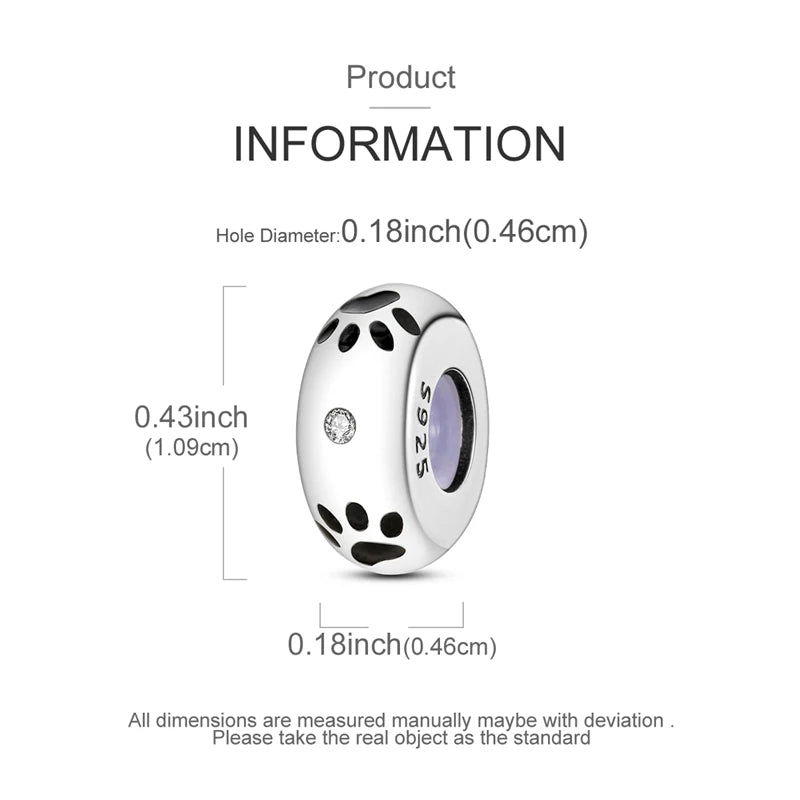 Silver charm with paw prints and measurements on a white background