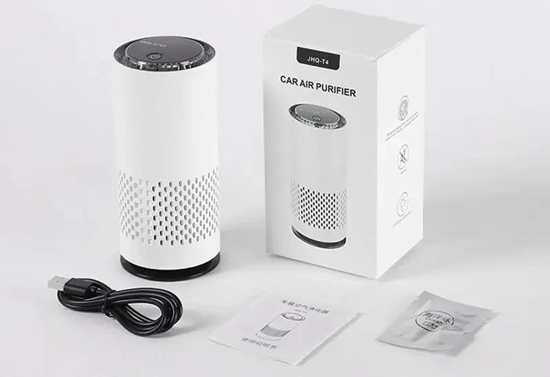 Car air purifier with packaging, power cable, and filter on a white background