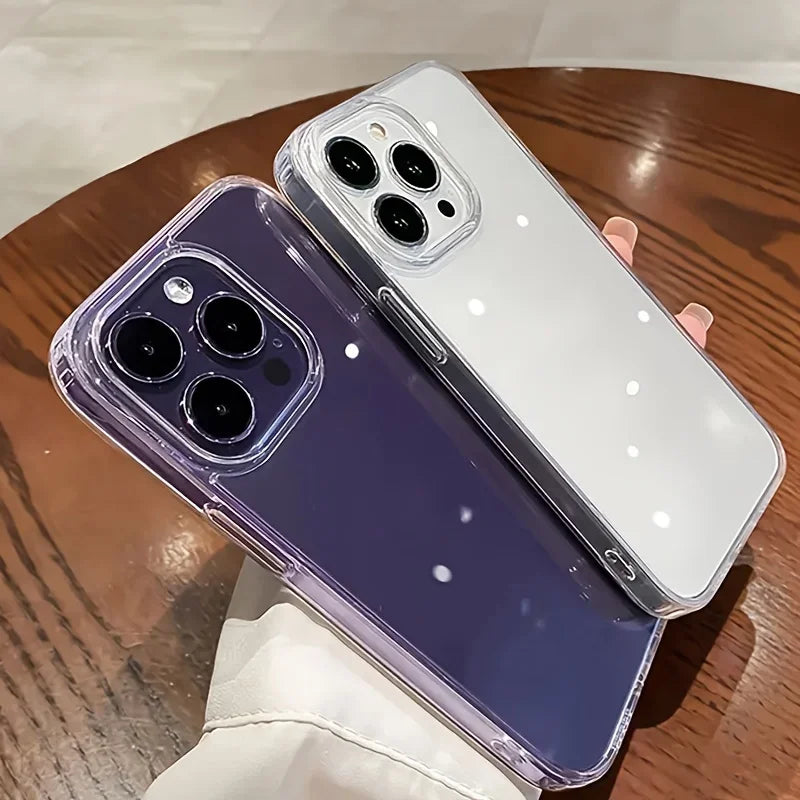 Two phone cases, one purple and one clear with white accents, on a wooden surface.