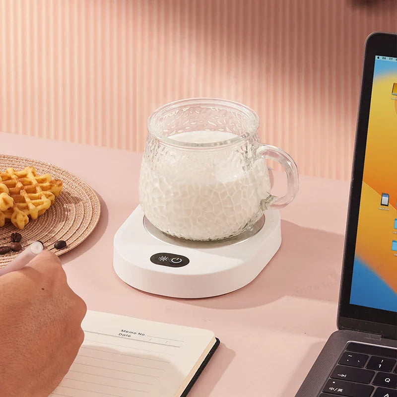 USB-powered thermostatic coffee warmer on a desk setup, maintaining milk temperature while working or studying.