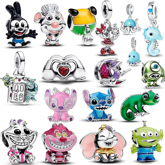 Collection of colorful cartoon character charms on a white pandora style