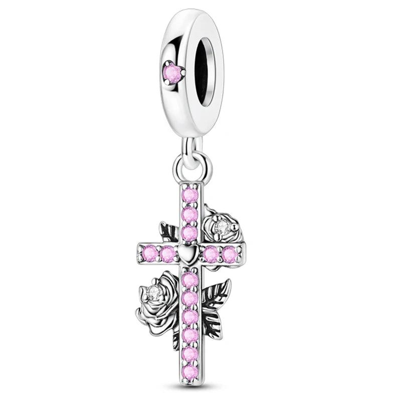 Silver charm with pink beads and rose design on a white background