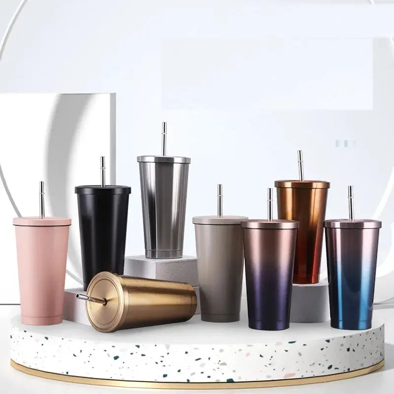 Collection of colorful tumblers with straws on a white surface