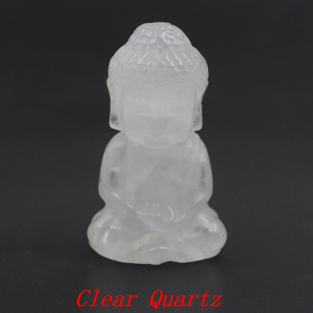 Clear quartz Buddha statue on a black background with 'Clear Quartz' text.
