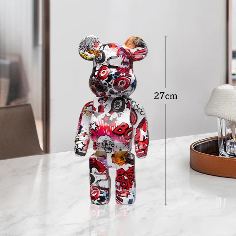 Colorful cartoon character figurine on a white surface with a measurement label indicating its height. be@rbrick collectable