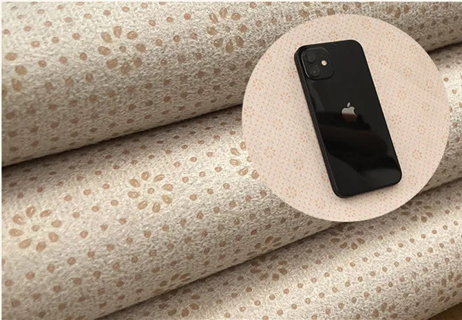 Phone on a roll of patterned back of rug