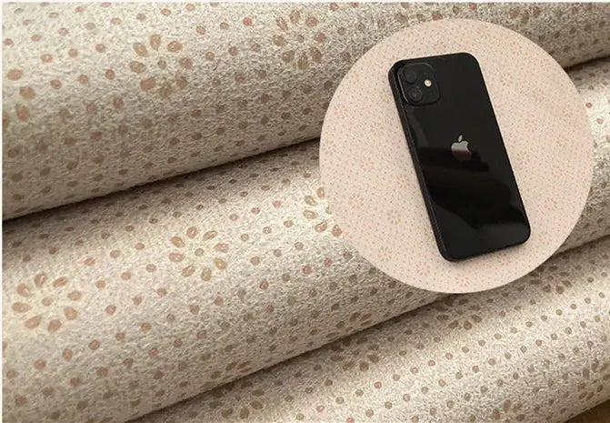 Phone on a roll of patterned back of rug