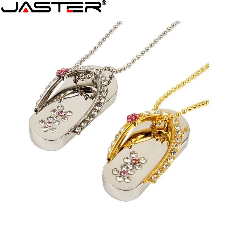 Flip-flop-shaped pendant necklace with gold and silver finish on a white background, featuring the brand 'JASTER'.