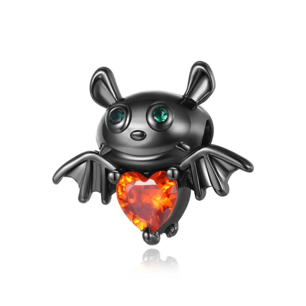 Black bat-shaped pendant with green eyes and a red heart on a white background pandora style charm pendant. Gothic style, halloween theme