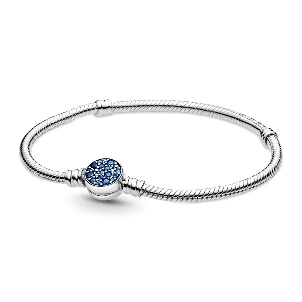 Silver bracelet with a blue gemstone charm on a white background