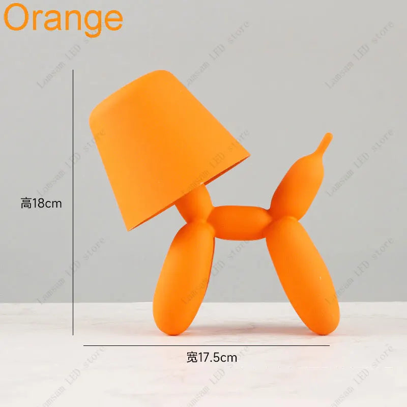Orange lamp with dimensions on a light gray background