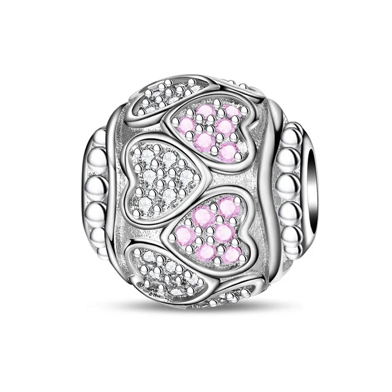 Silver charm with pink heart-shaped stones on a white background