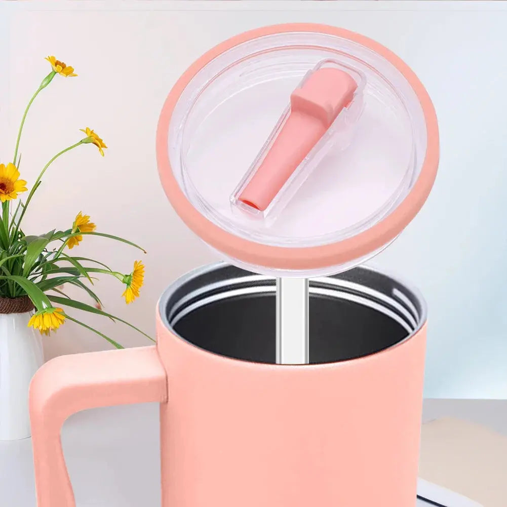 Close-up of pink flip straw lid on 40 oz tumbler, reusable and spill proof replacement for Stanley Quencher with clear straw