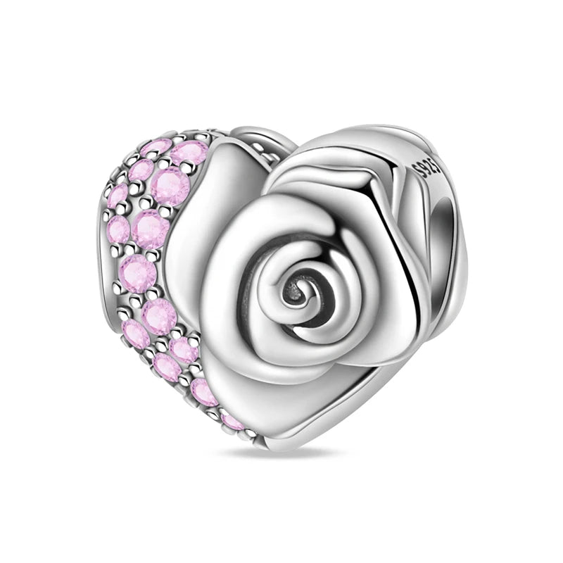 Silver rose-shaped charm with pink gemstones on a white background