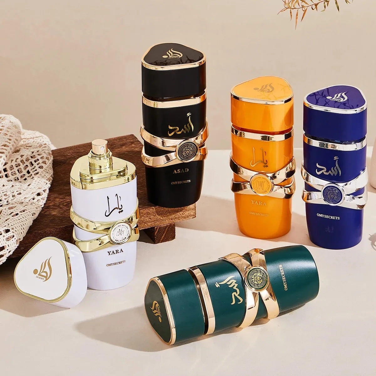 Collection of various perfume bottles with different colored caps on a light background