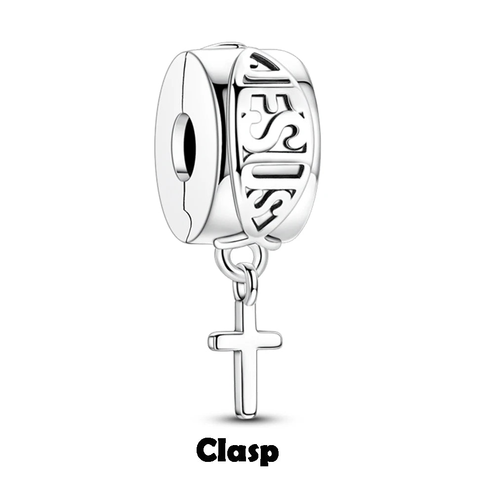 Silver clasp charm with 'Jesus' engraving and cross on a white background