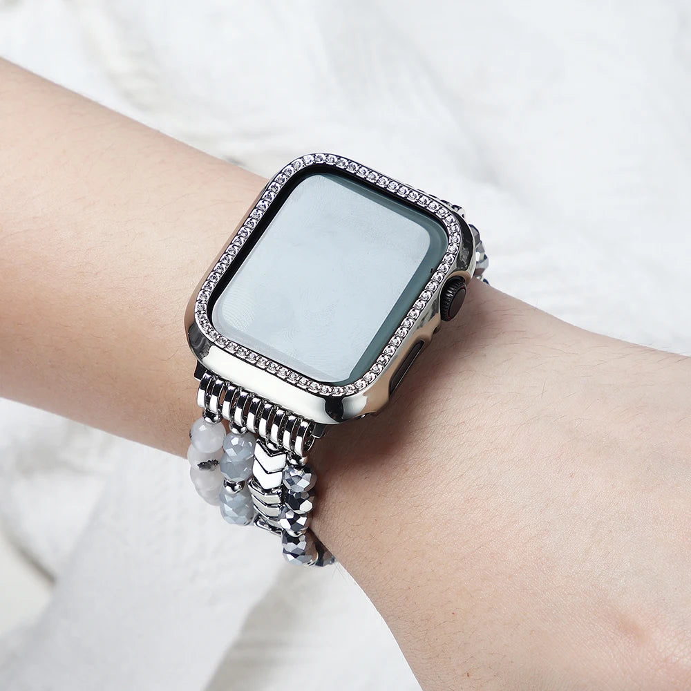 Smartwatch with a decorative band on a wrist against a white background