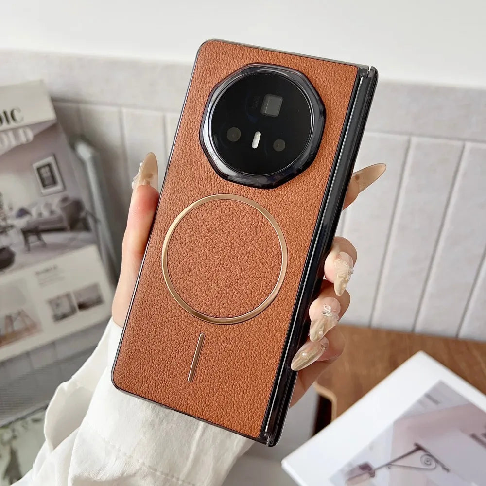Person holding a smartphone with a brown leather case in a casual indoor setting
