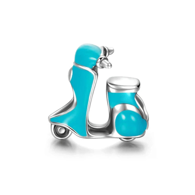 Turquoise scooter-shaped charm on a white background pandora style
