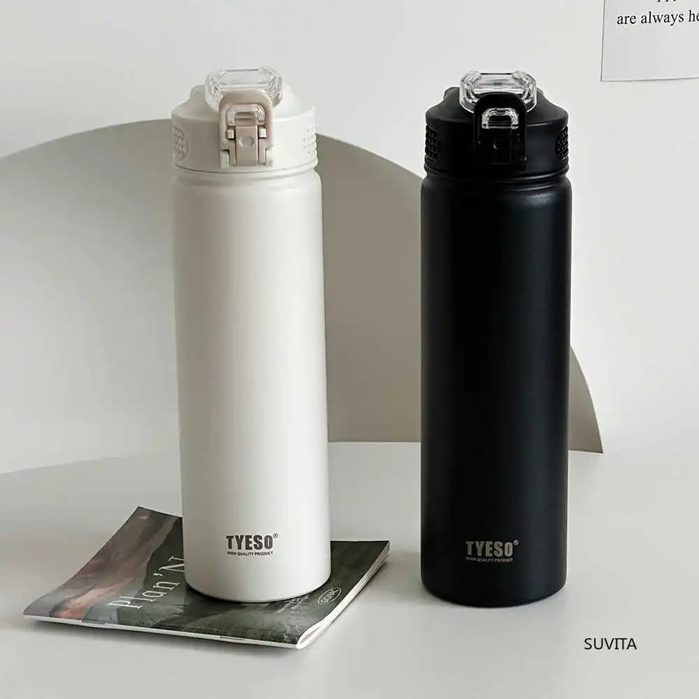 TYESO thermos bottles in white and black with secure straw lids. Double-wall insulated for hot or cold beverages.