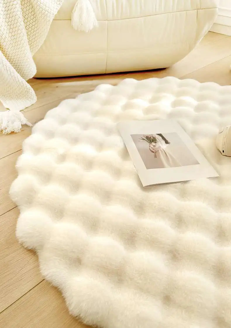 White fluffy rug on a wooden floor with a photo on top
