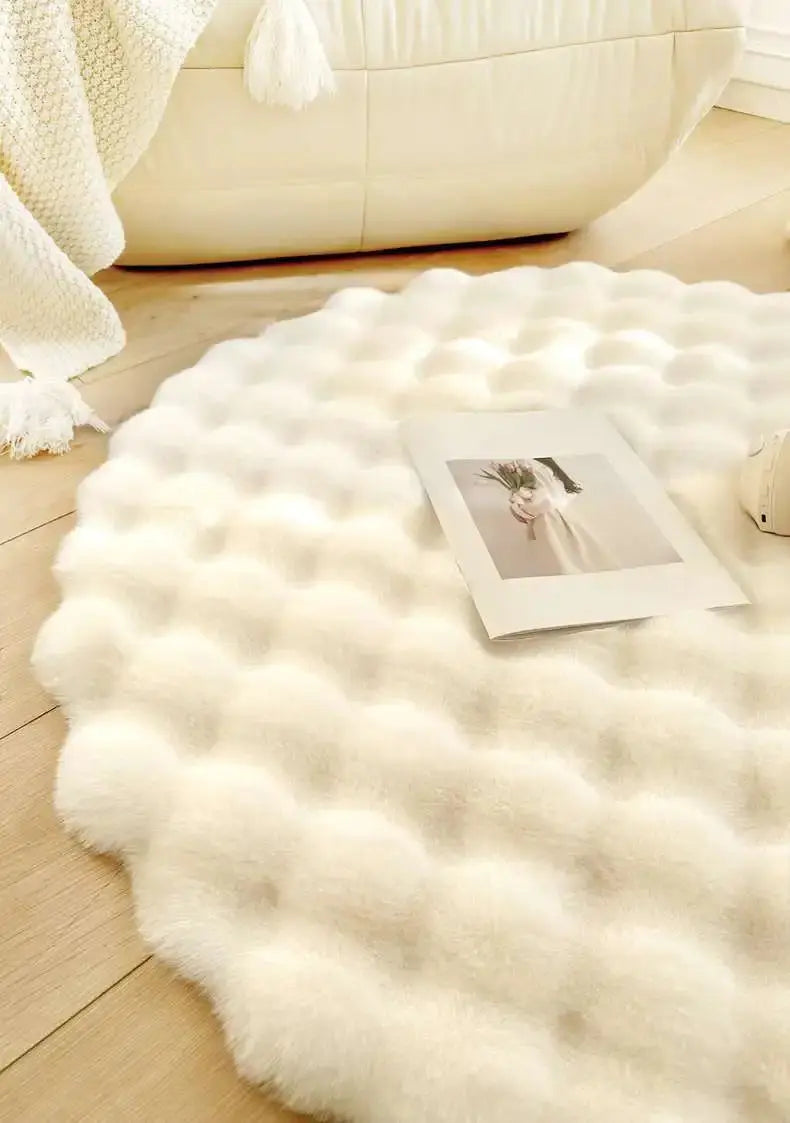 White fluffy rug on a wooden floor with a photo on top