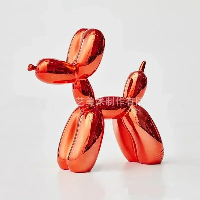 Red balloon dog sculpture on a white background