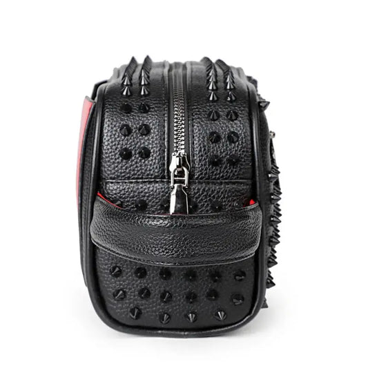 Black studded backpack on a white background