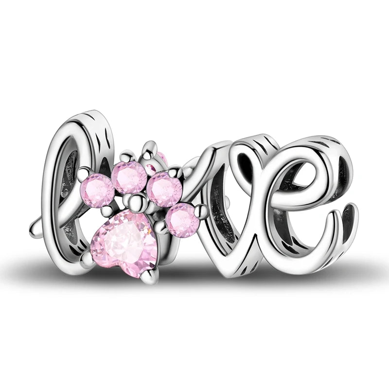 Silver charm with pink paw prints and 'LOVE' letters on a white background