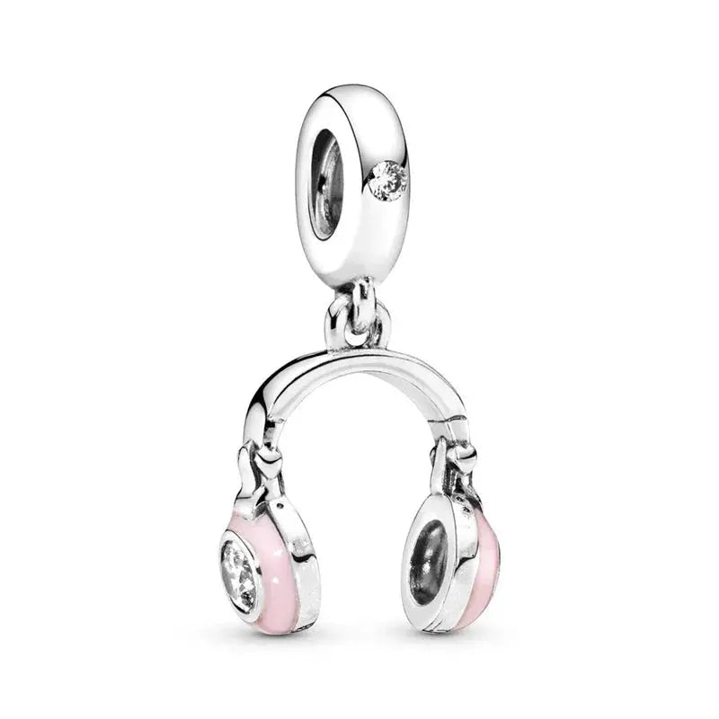 Headphones Silver charm with pink accents on a white background